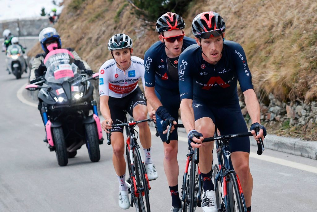 Team Ineos rider Australias Rohan Dennis R Team Ineos rider Great Britains Tao Geoghegan Hart C and Team Sunweb Australians rider Jai Hindley L lead the race uphill at Passo dello Stelvio Stelvio Pass during the 18th stage of the Giro dItalia 2020 cycling race a 207kilometer route between Pinzolo and Laghi di Cancano on October 22 2020 Photo by Luca Bettini AFP Photo by LUCA BETTINIAFP via Getty Images