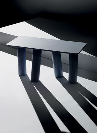 Small grey table with thick legs