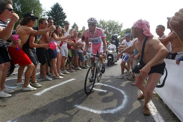 Alberto Contador (Saxo Bank Sungard) powers uphill through a corridor of noise.