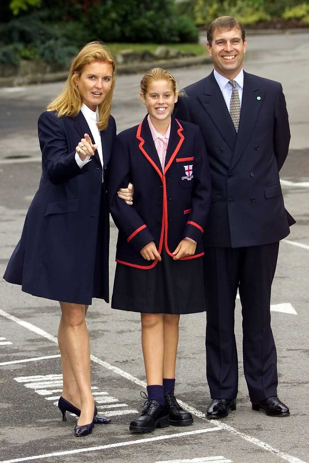 Princess Beatrice posing with Ex-Prince Andrew and Sarah Ferguson on her first day of school in 2000