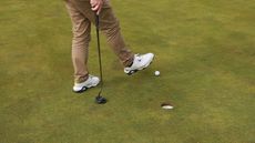 Stopping a golf ball with foot