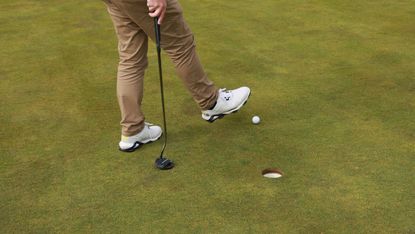 Stopping a golf ball with foot