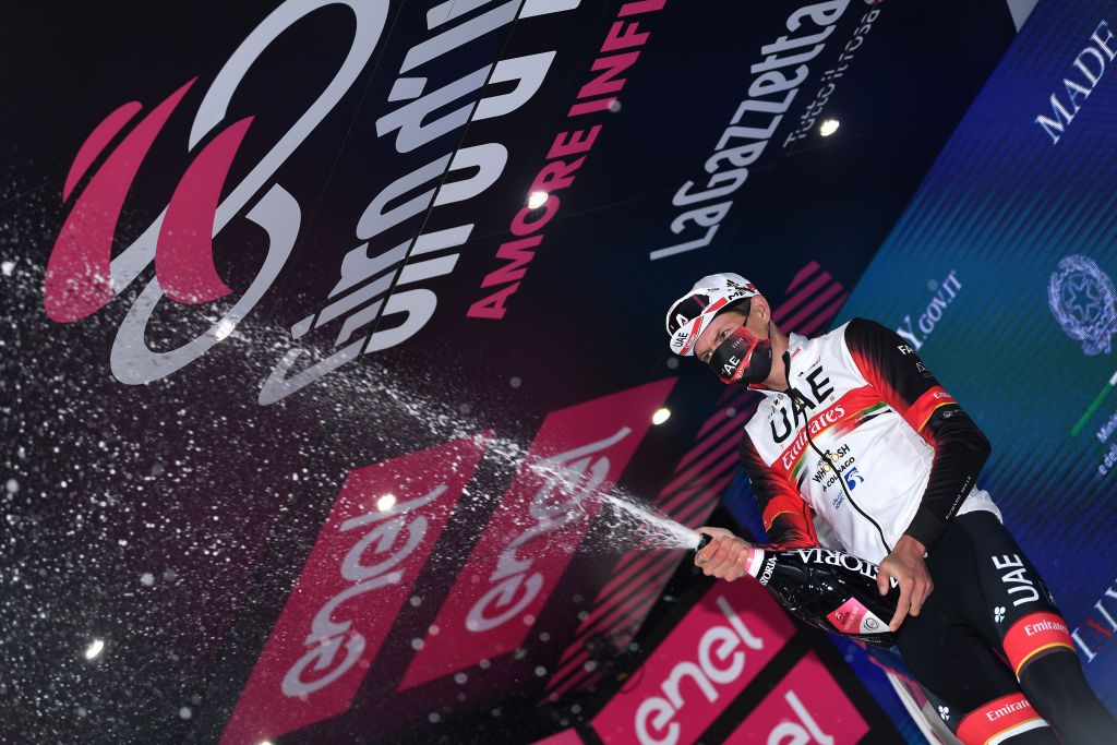 SESTOLA ITALY MAY 11 Joseph Lloyd Dombrowski of United States and UAE Team Emirates celebrates at podium during the 104th Giro dItalia 2021 Stage 4 a 187km stage from Piacenza to Sestola 1020m Champagne girodiitalia Giro UCIworldtour on May 11 2021 in Sestola Italy Photo by Tim de WaeleGetty Images