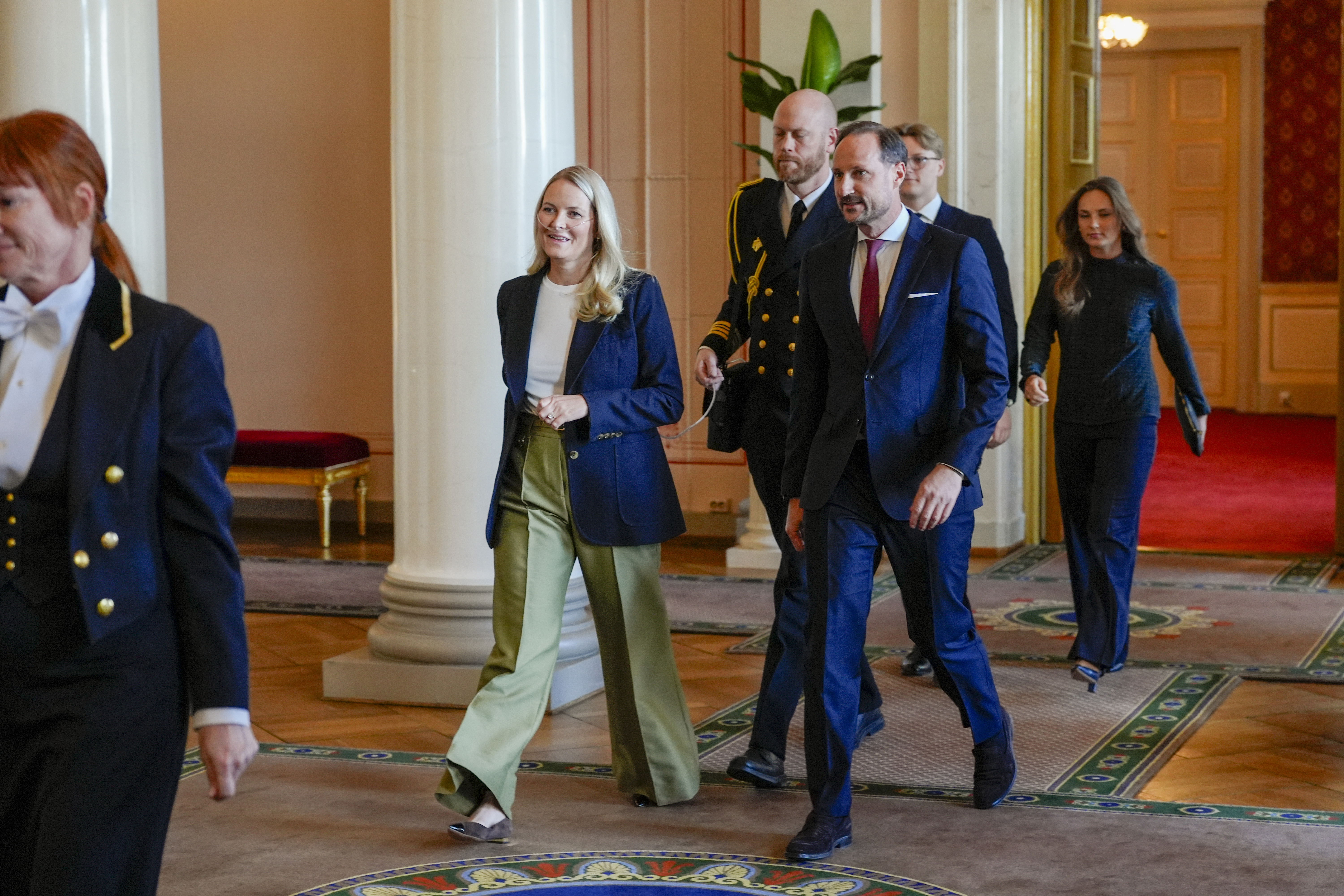 Crown Princess Mette-Marit walking next to Crown Prince Haakon