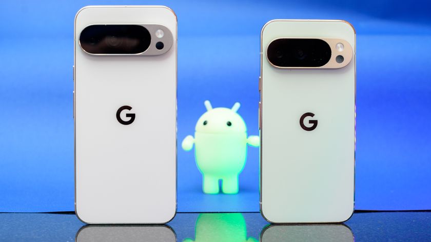 Google Pixel 10 Pro XL in Porcelain against a blue background with a green neon Android figurine in the background