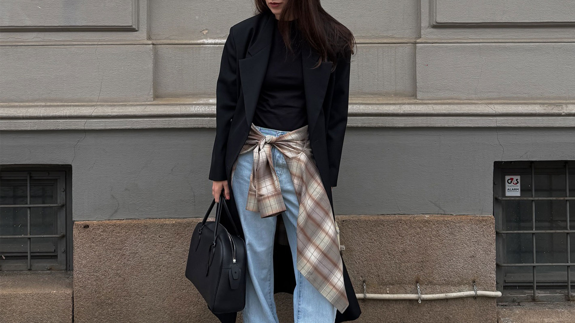 @annabelrosendahl outfit photo black blazer with blue jeans and plaid shirt around waist