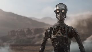 A protocol droid stands in a desert