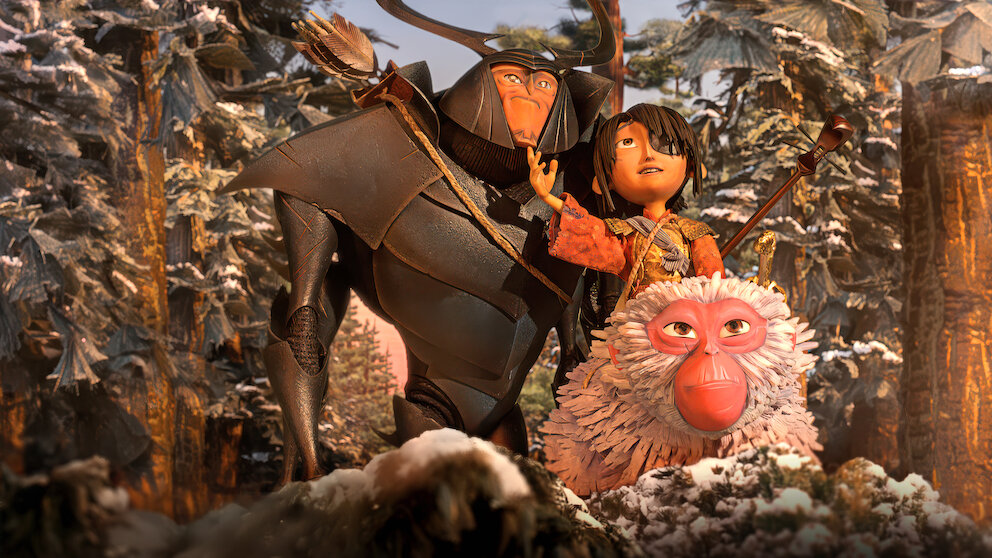 Image of Beetle, Monkey and Kubo in Kubo and the Two Strings. They are all smiling in a sunny environment.