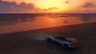 Car on sunset beach