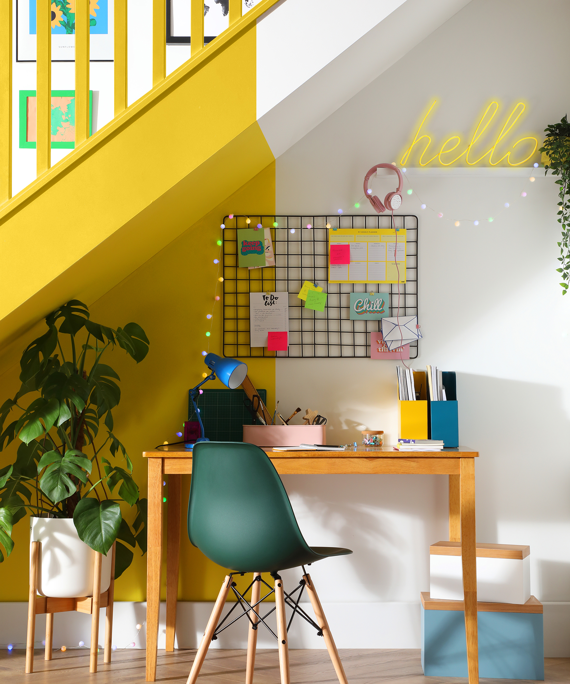 Home office idea under the stairs with wall storage by Furniture and Choice