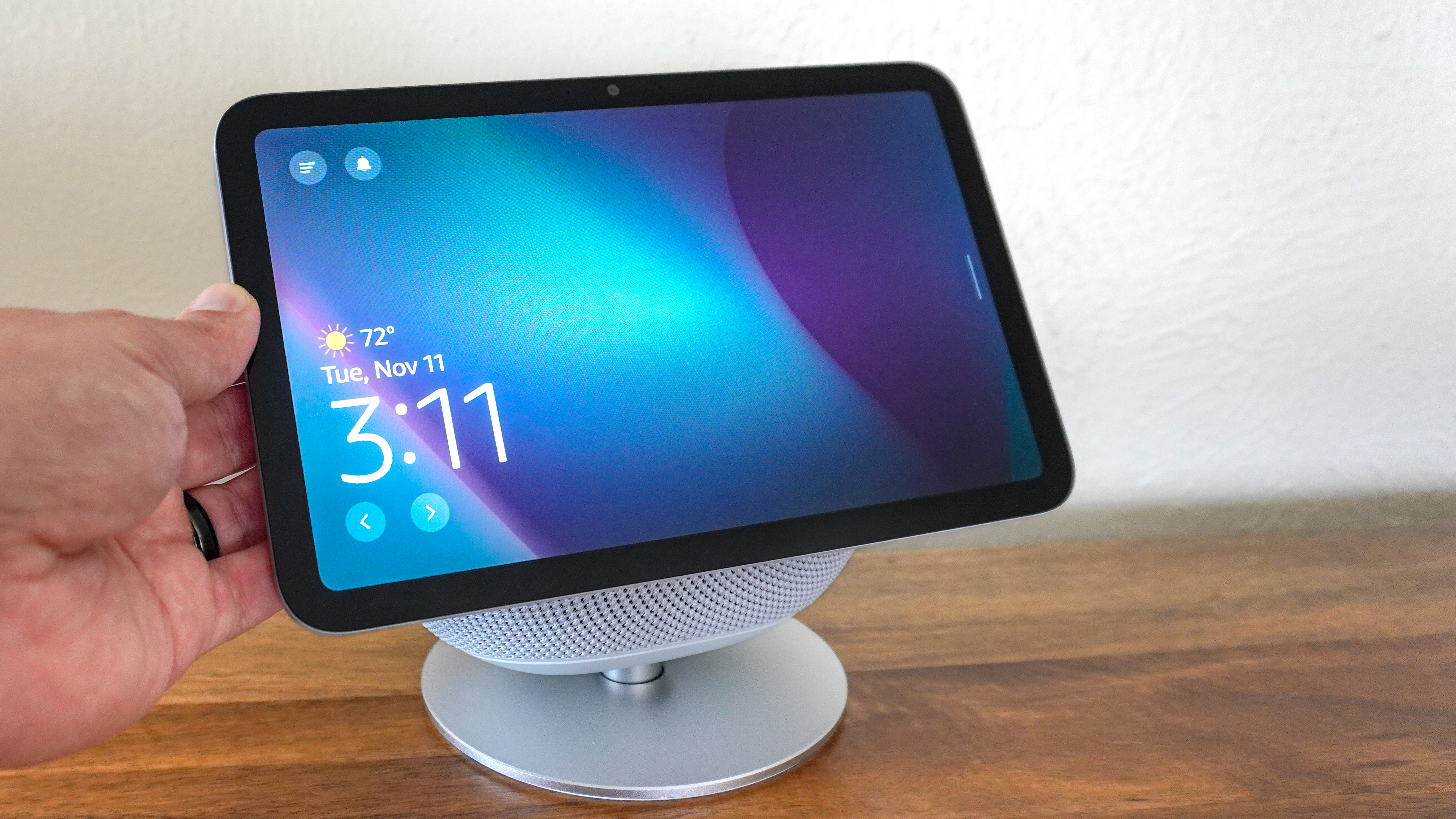 A person rotating the Echo Show 8 (4th Gen) using the optional adjustable stand