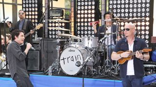Singer Pat Monahan, Drummer Scott Underwood and and guitarist Jimmy Stafford of Train perform on NBC's "Today" Show at Rockefeller Plaza on August 24, 2012 in New York Cit
