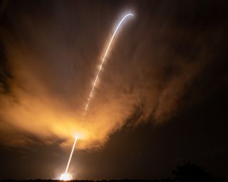 The Delta IV Heavy rocket carrying NASA's Parker Solar Probe carves a fiery trail into the predawn sky in this long-exposure photograph taken on Aug. 12, 2018.