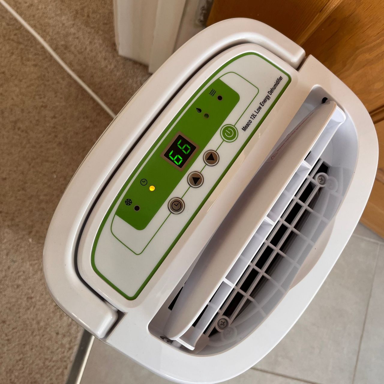 meaco 12l low energy dehumidifier on timer outside bathroom