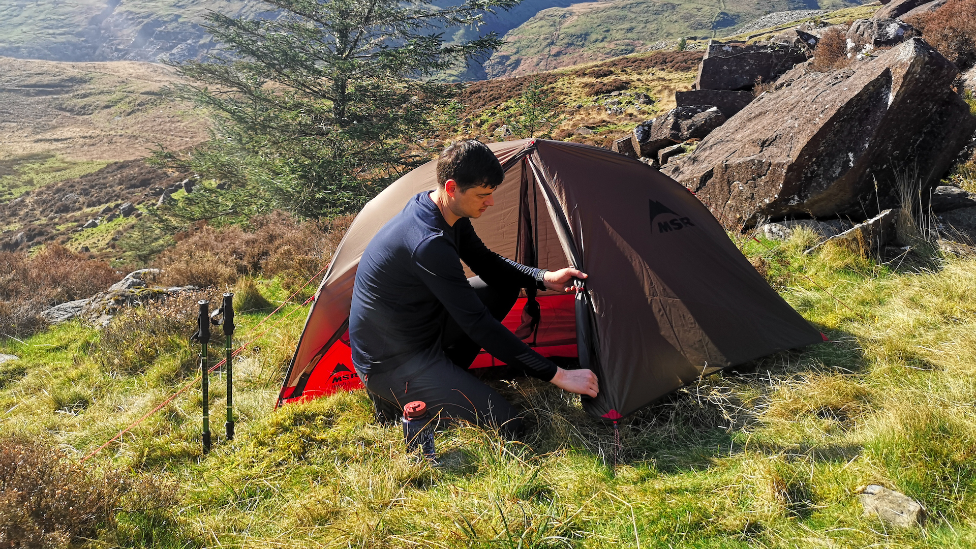 Man pitching MSR FreeLite 1 tent