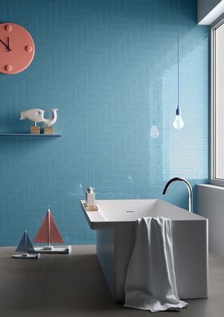 Bright colored blue tiles in a family bathroom