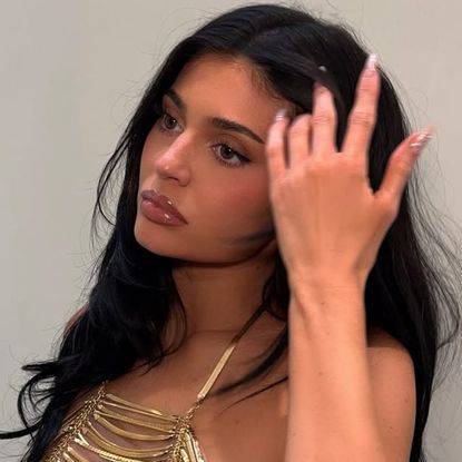 Kylie Jenner went on Kid Cudi's new podcast in a bomber jacket, straight-leg jeans, and pointy pumps