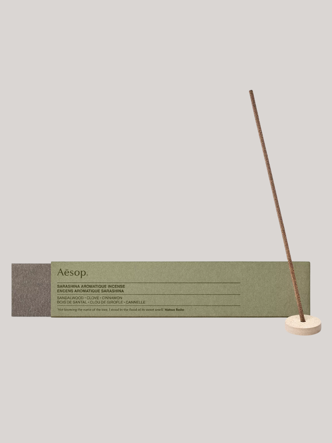 A box of incense sticks and a small holder from Aesop