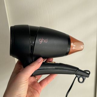 Laura holding ghd Flight+ Travel Hair Dryer - best hair dryers