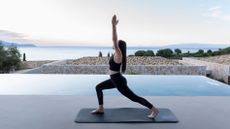 A woman striking a yoga pose at Eliamos