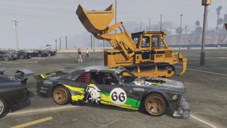 A still image from TuttoAuto's tribute video to Ken Block, showing a car drifting between a bulldozer and another car.