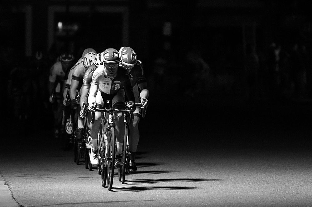 UHC stringing out the field through stretches of darkness and light, making depth of field difficult, yet allowing for breaks to ride away almost unnoticed.