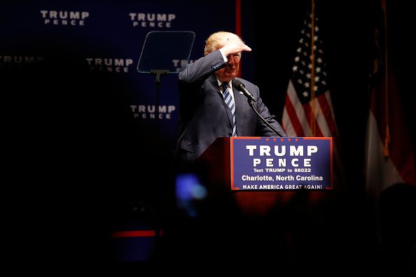 Donald Trump peers out at his supporters.