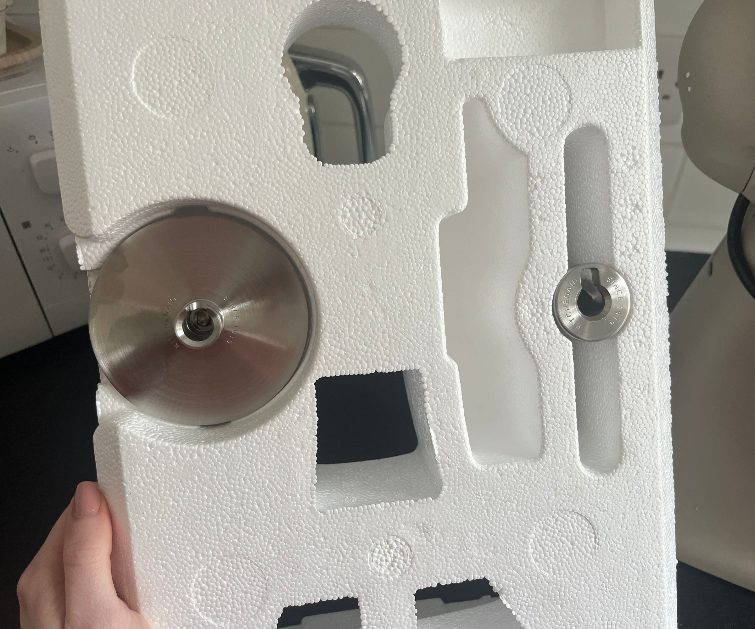 Stainless steel attachments for the KitchenAid Artisan Plus Stand Mixer in styrofoam packadging