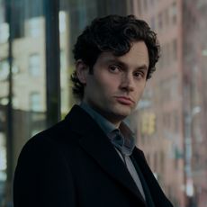 penn badgley as joe goldberg in a black peacoat in a still from you season 5