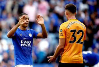 Leicester's Youri Tielemans commiserates with Leander Dendoncker after Wolves were denied victory
