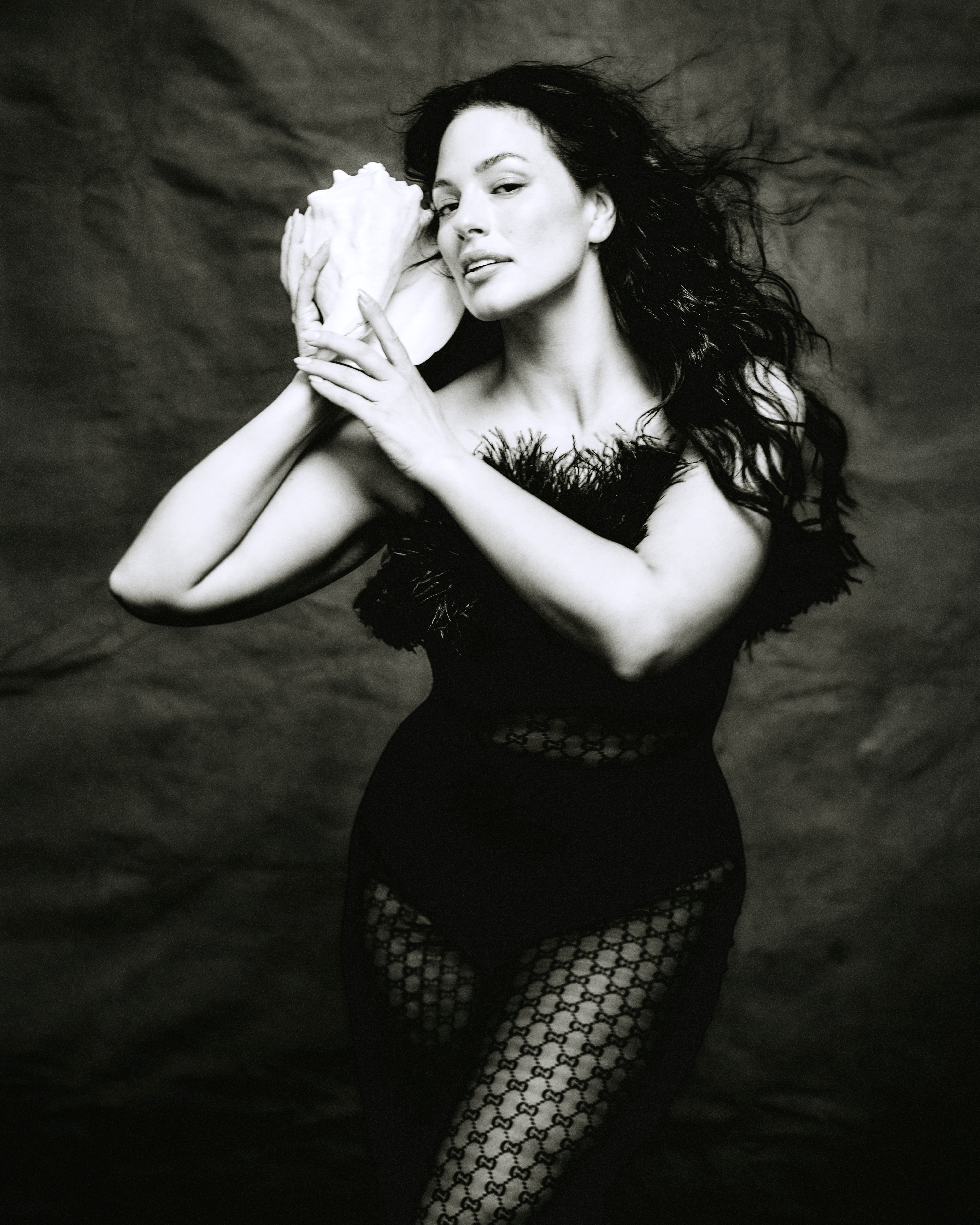 Ashley Graham poses with a conch shell for Marie Claire