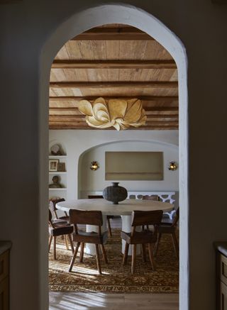 dining room filled with antique furniture and timber ceiling