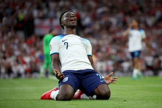 Bukayo Saka of England celebrates after scoring the team's fifth goal and his third during the UEFA EURO 2024 qualifying round group C match between England and North Macedonia at Old Trafford on June 19, 2023 in Manchester, England.