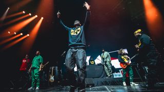Cody Nierstedt performs onstage with Wu-Tang Clan