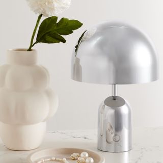 A silver sculptural lamp from Net-A-Porter