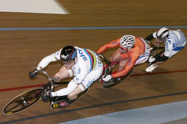 Sir Chris Hoy (Great Britain) leads Teun Mulder (Netherlands) and Christos Volikakis (Greece) around the boards during second round of the men's keirin.