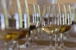 A close up of several glasses of sherry