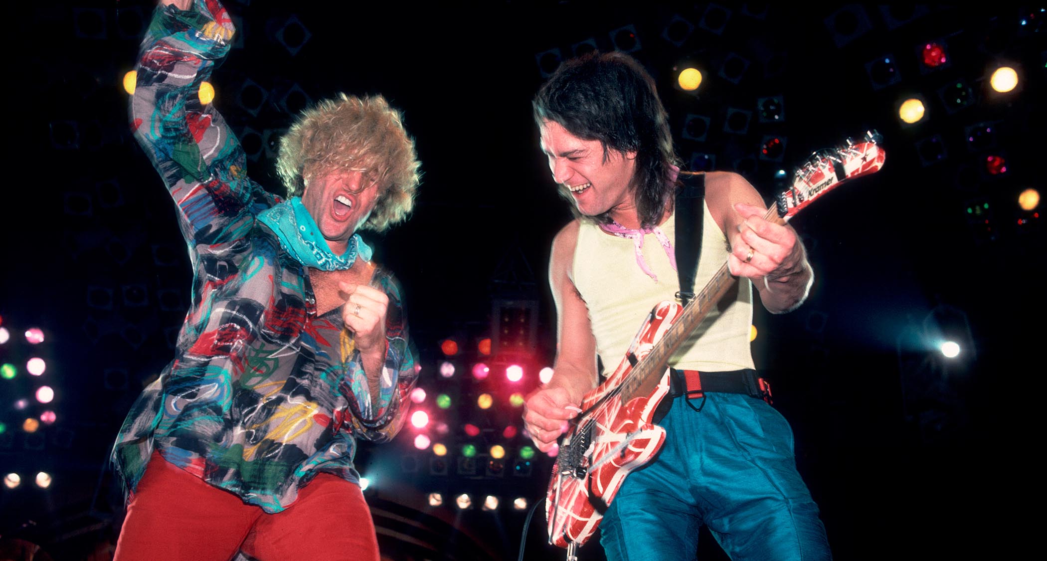 Sammy Hagar and Eddie Van Halen having a good time onstage in 1986