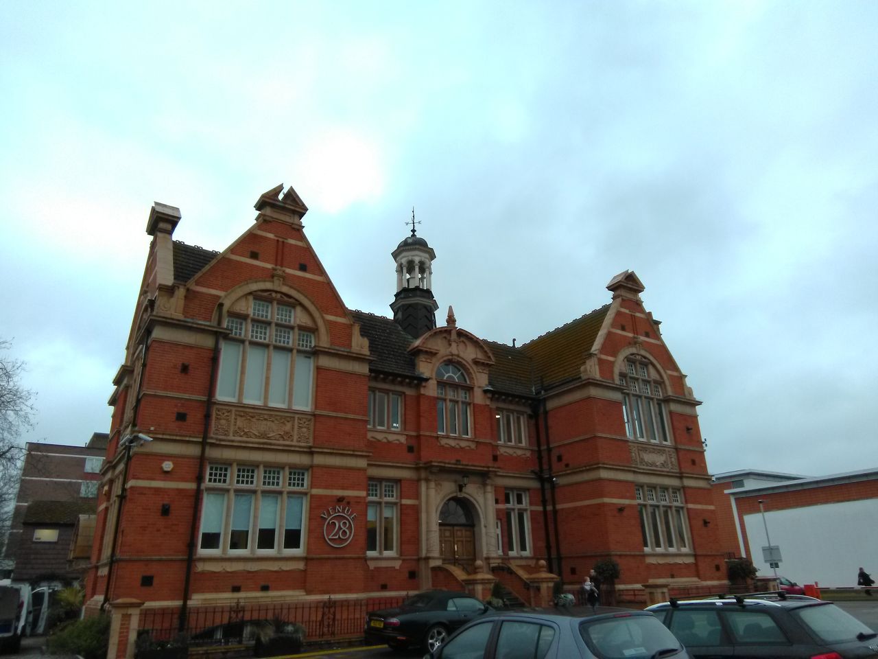 Even though the building appears quite dim, parts of the sky are blown out. Also, note the clouds appear excessively green. They are not natural-looking.