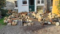 A collection of bricks in front of a house