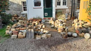 A collection of bricks in front of a house