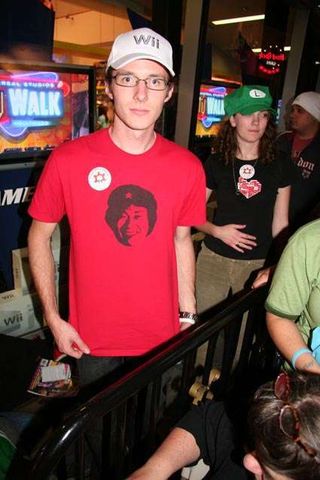 A Nintendo fan in line for the Wii shows off his Shigeru Miyamoto T-shirt.