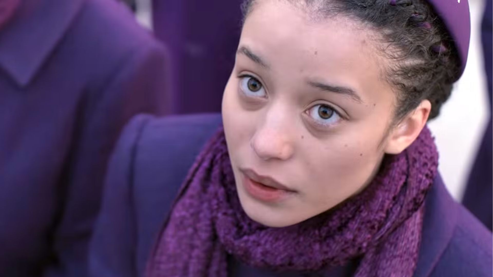 Agnes looks up at something offscreen