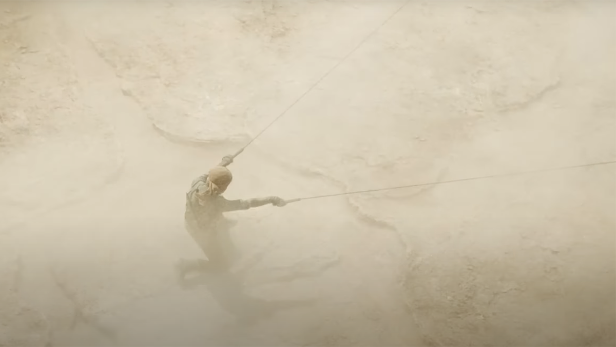 Paul riding the sandworm in Dune: Part Two