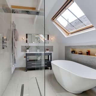 bathroom with white wall and bathtub with window
