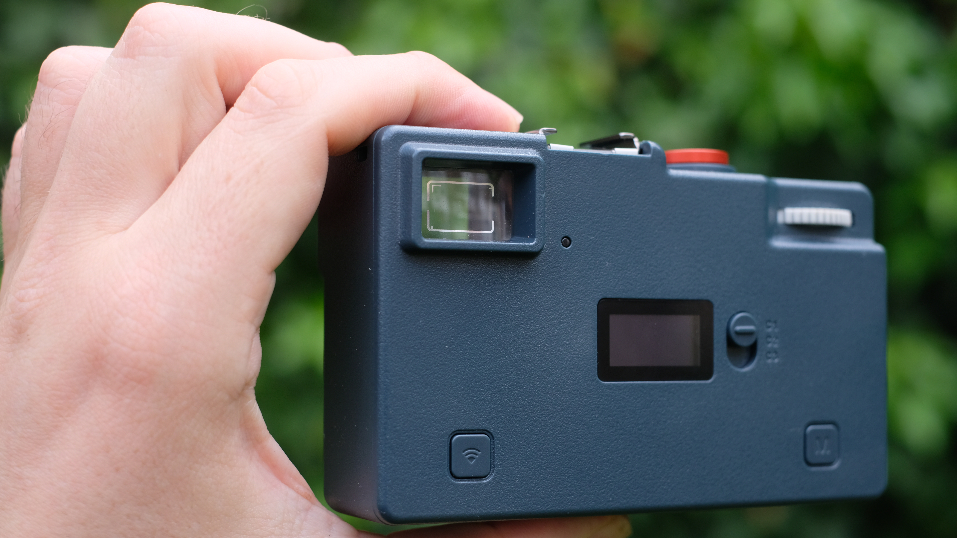 Photograph of RewindPix digital compact camera showing rear with big optical viewfinder