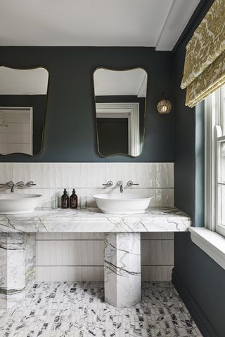 double marble vanity in a bathroom with blue walls
