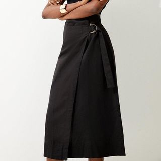 model wearing Karen Millen Aysmmetric Midi Skirt