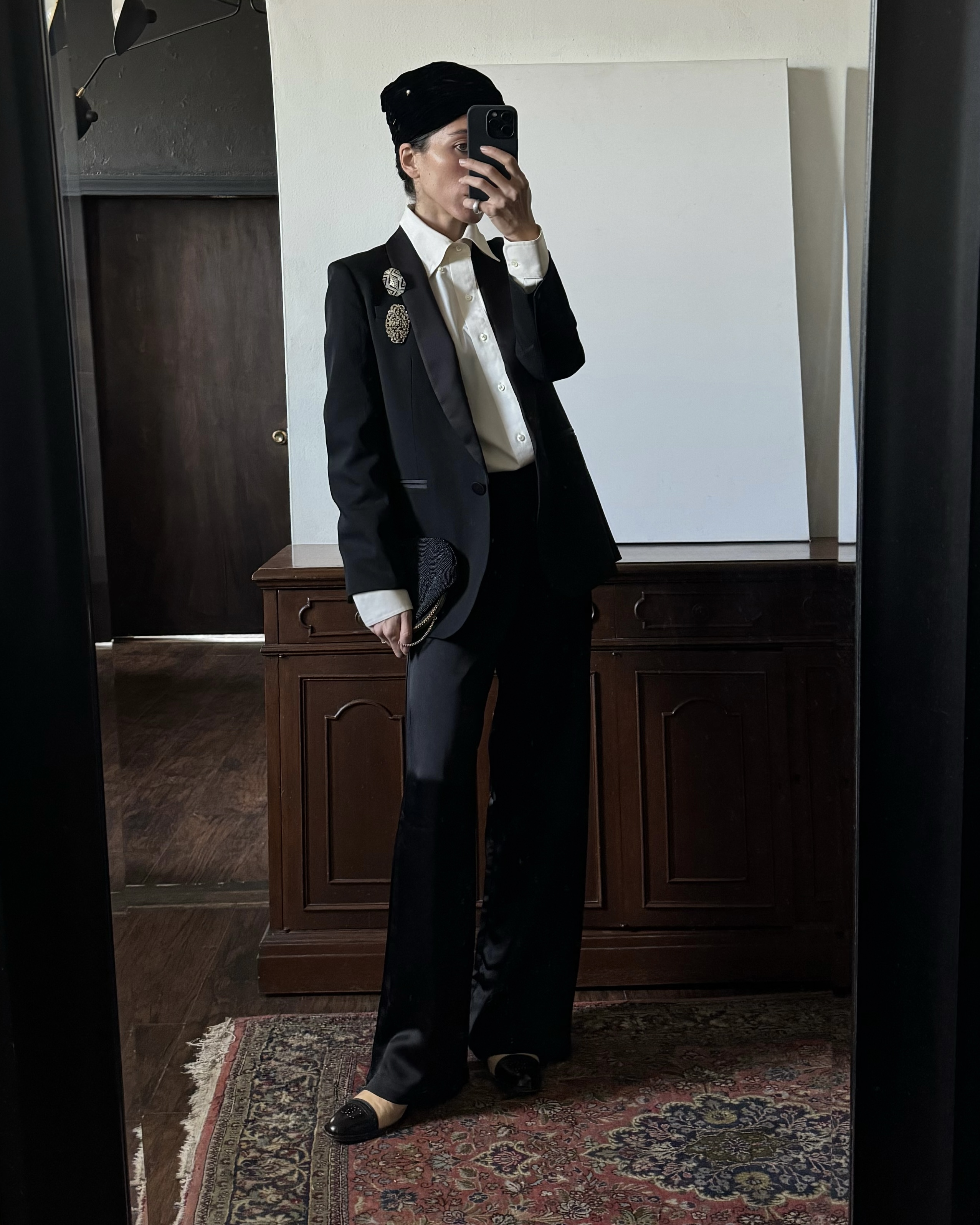 Alexis Badiyi wearing a black blazer and pajama pants