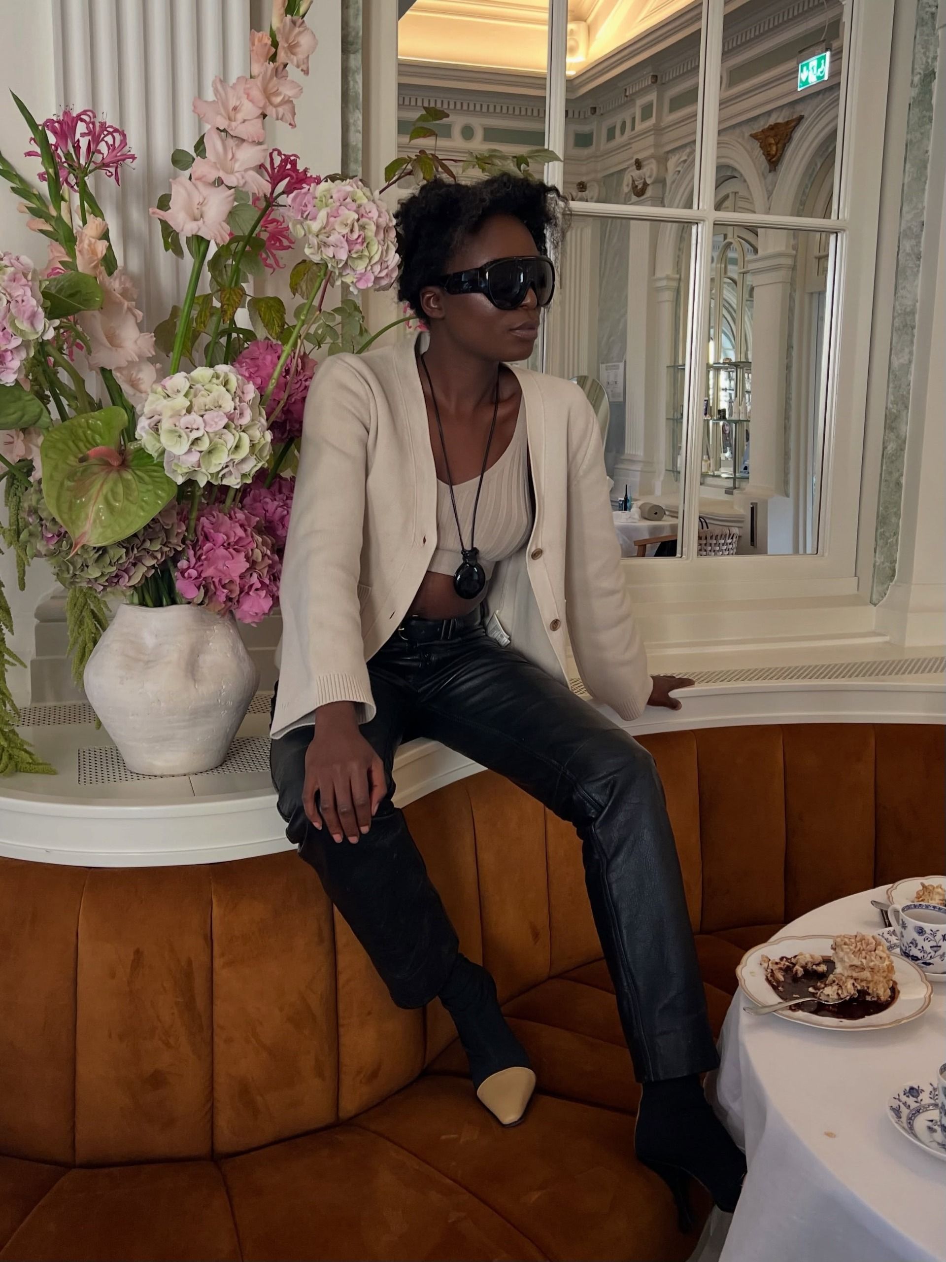A woman wearing a fall leather-pant outfit in 2026.